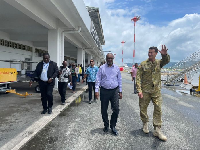 Vanuatu Prime Minister Charlot Salwai surveys Cyclone Lola damage from the air