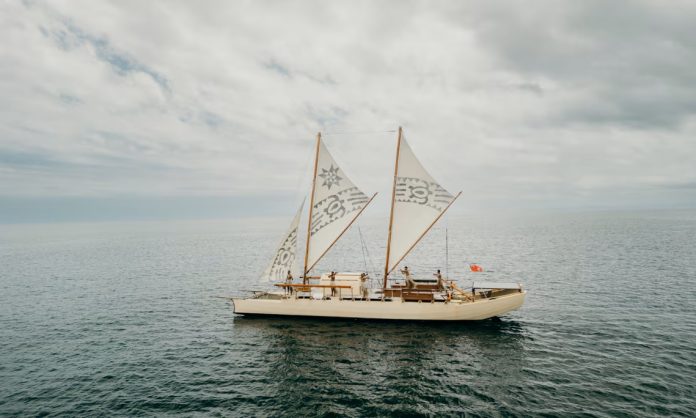 ‘Even in the teeth of a gale, she has time for a hula’: the sailor breaking barriers on the Pacific Ocean