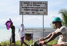 Migration with dignity? Kiribati swaps escape to purchased Fiji plot for sea walls to save their land